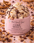 Cookie Monsta whipped body butter with cookie crumbs and chocolate chips on a textured background