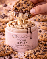 Cookie Monsta whipped body butter being scooped with a cookie, surrounded by cookies and chocolate chips.