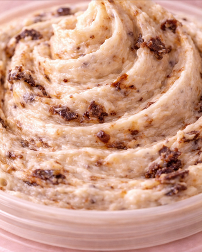 Close-up of a swirl of creamy Cookie Monsta Body Butter with chocolate chips.