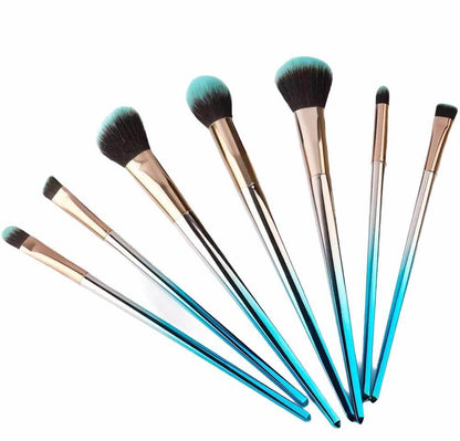 7 pc. Unicorn brushes with blue and gold gradient handles and two toned bristles
