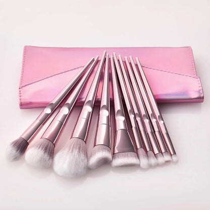 10 pc. Pink Makeup Brushes lying on Pink Clutch