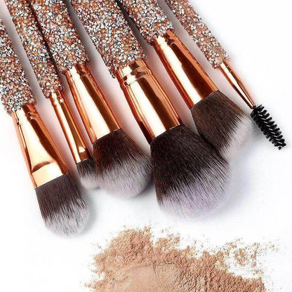 Makeup Brushes lying next to face powder