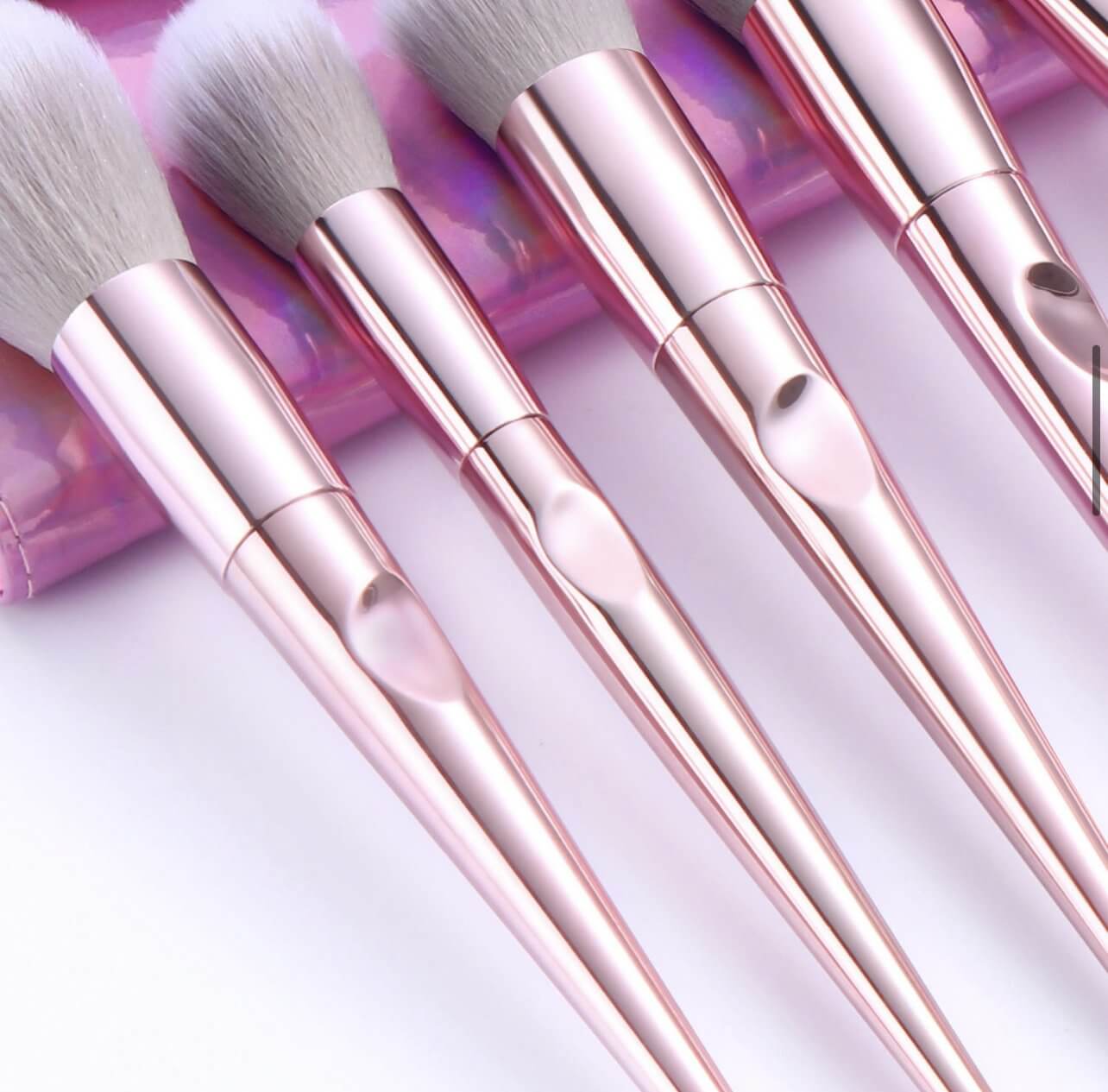 Texture shot of pink chrome handles on Makeup Brushes