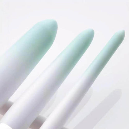 Closeup of makeup brush handles, white and blue